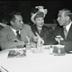 Eddie Cantor, right, talks with comedienne Lucille Ball, center, and her husband Desi Arnaz during dinner at Los Angeles' Brown Derby, Oct. 10, 1946. (AP Photo)